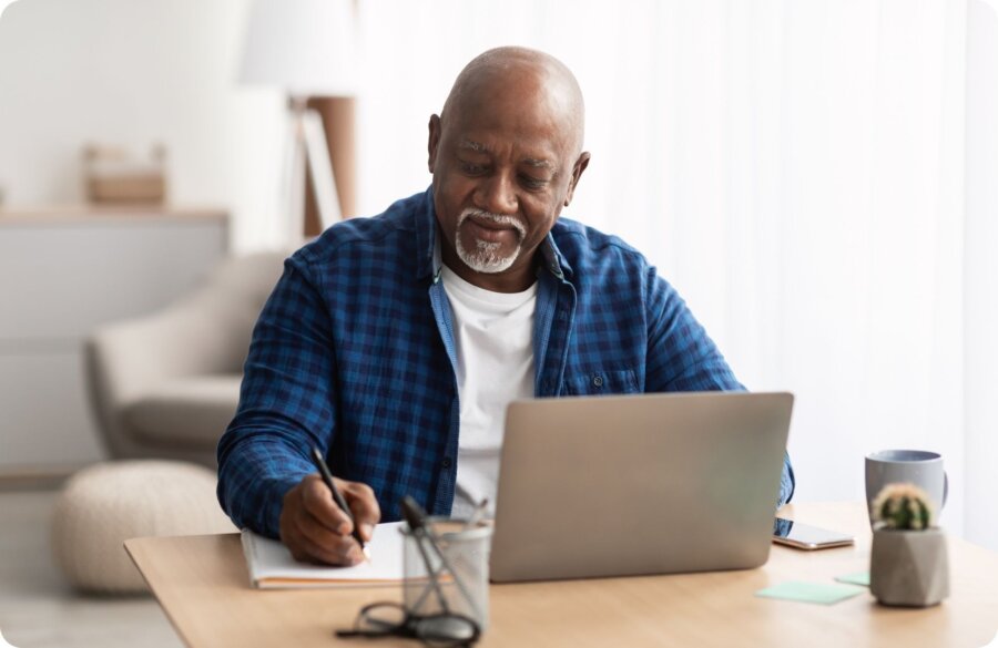 Man at computer Website Image beside text 2000 x 1300 px