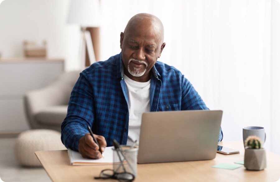 Man at computer Website Image beside text 2000 x 1300 px