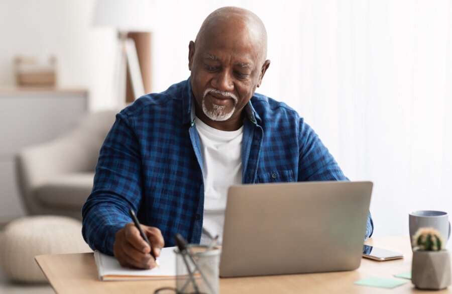 Man at computer Website Image beside text 2000 x 1300 px