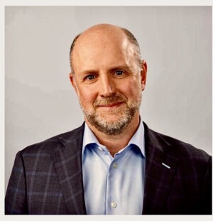 A headshot of Andrew Clark